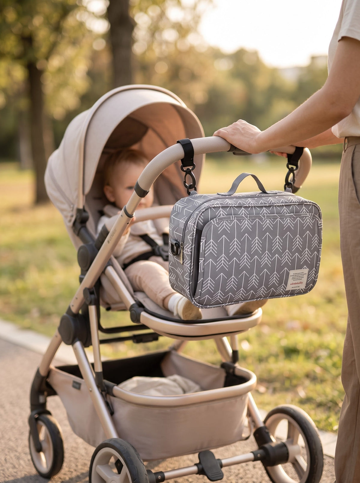 Grey arrow print diaper bag on stroller
