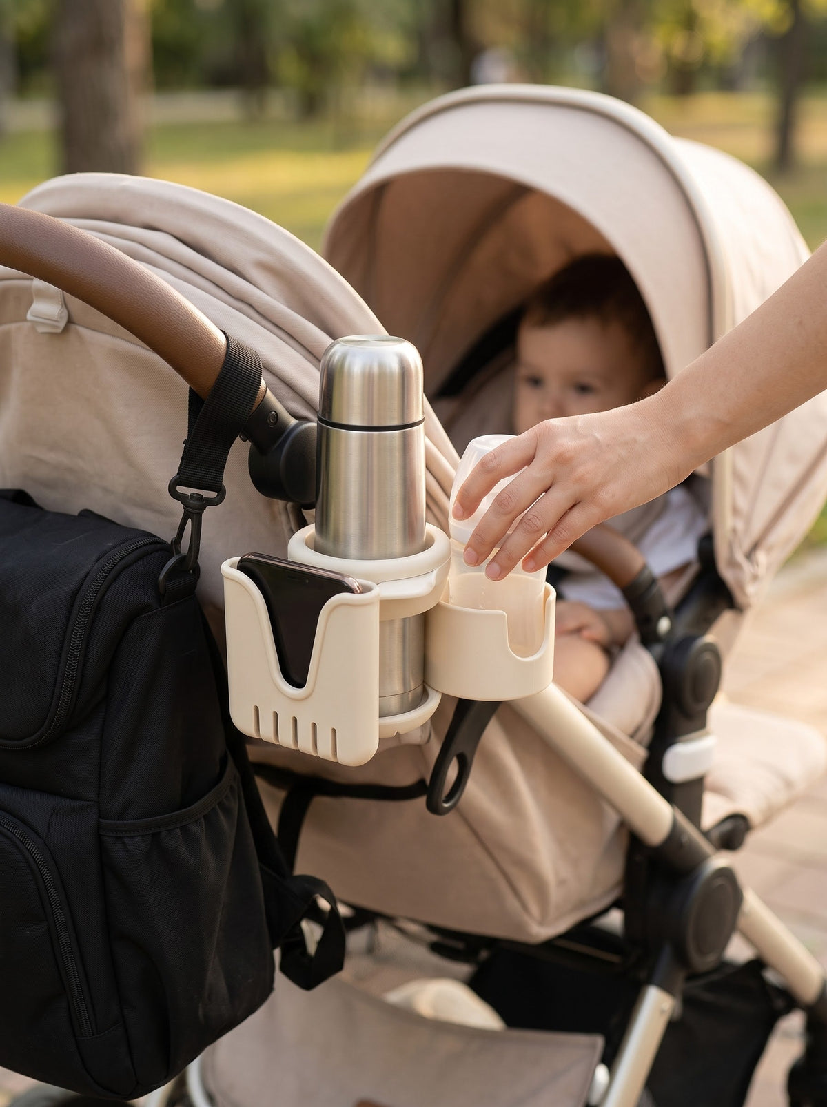 Double cup holder attached to stroller in use