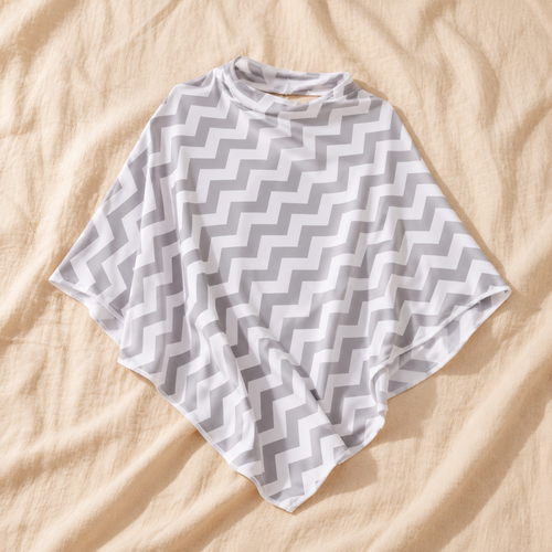 Grey and white chevron nursing cover laid flat on cream linen