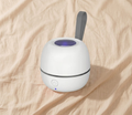 Portable UV pacifier steriliser on cream linen background